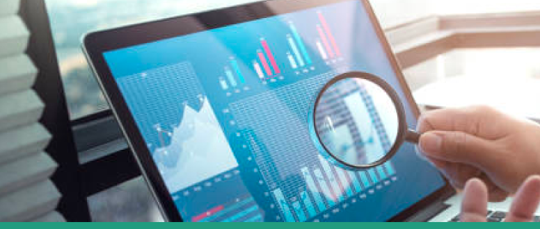 Laptop showing graphs and analysis with person holding magnifying glass in frount of the screen