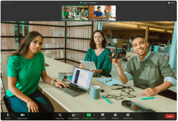 People sat round a conference table using Zoom
