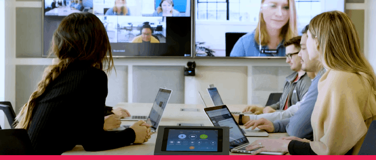 People using Zoom in a Zoom Room with big screen