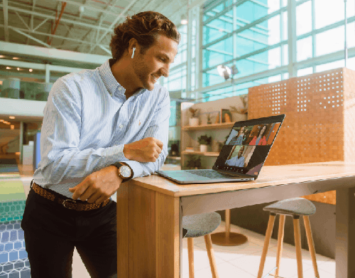 Person at standing desk on video call