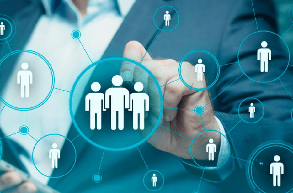 Recruiter pointing at images of people on glass touchscreen